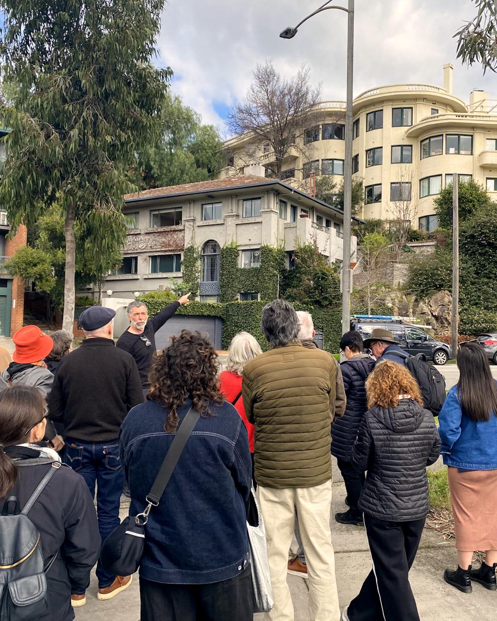 Nick pointing out a building to a walk group in South Yarra